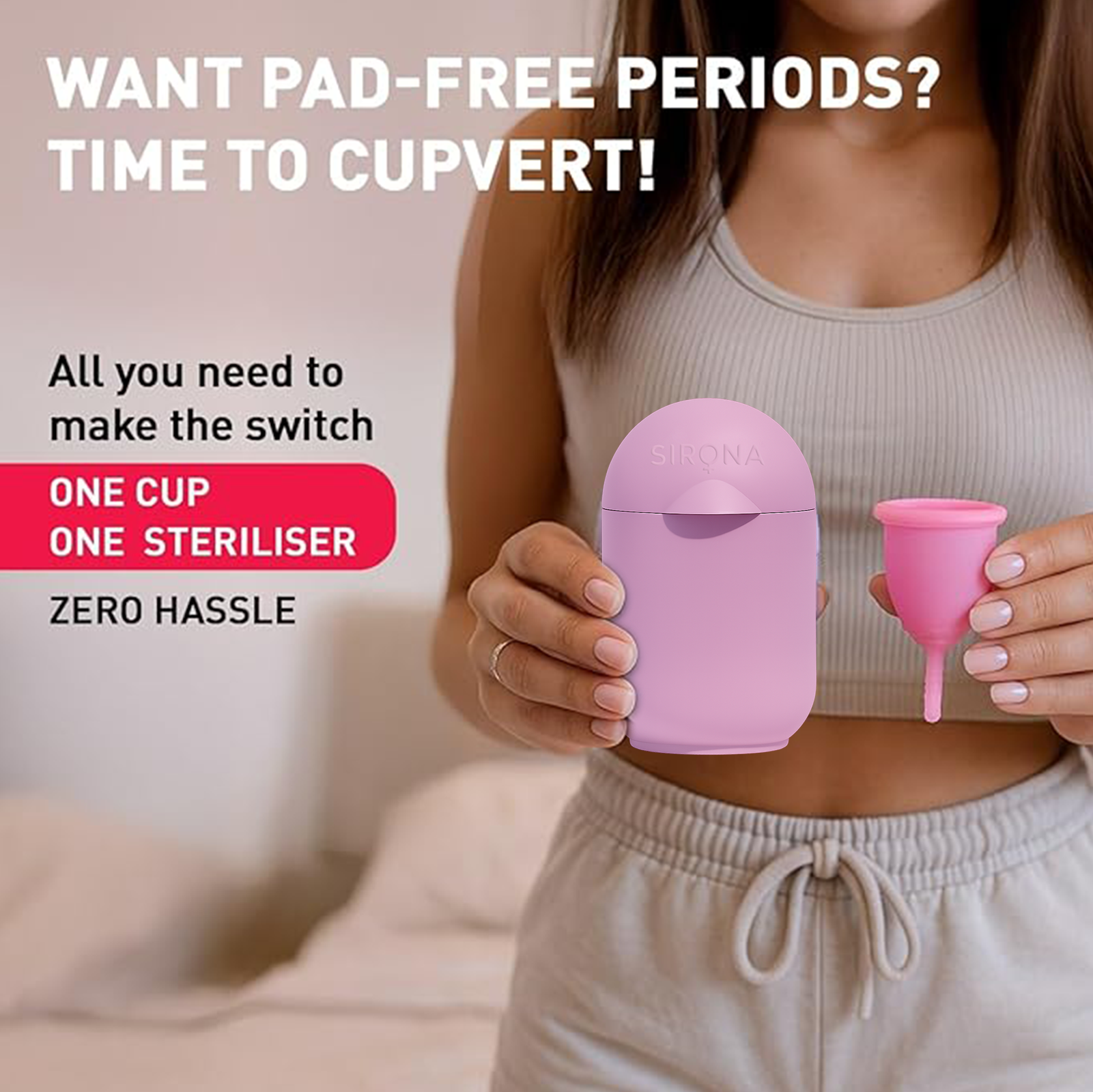 Person holding a pink menstrual cup and sterilizer