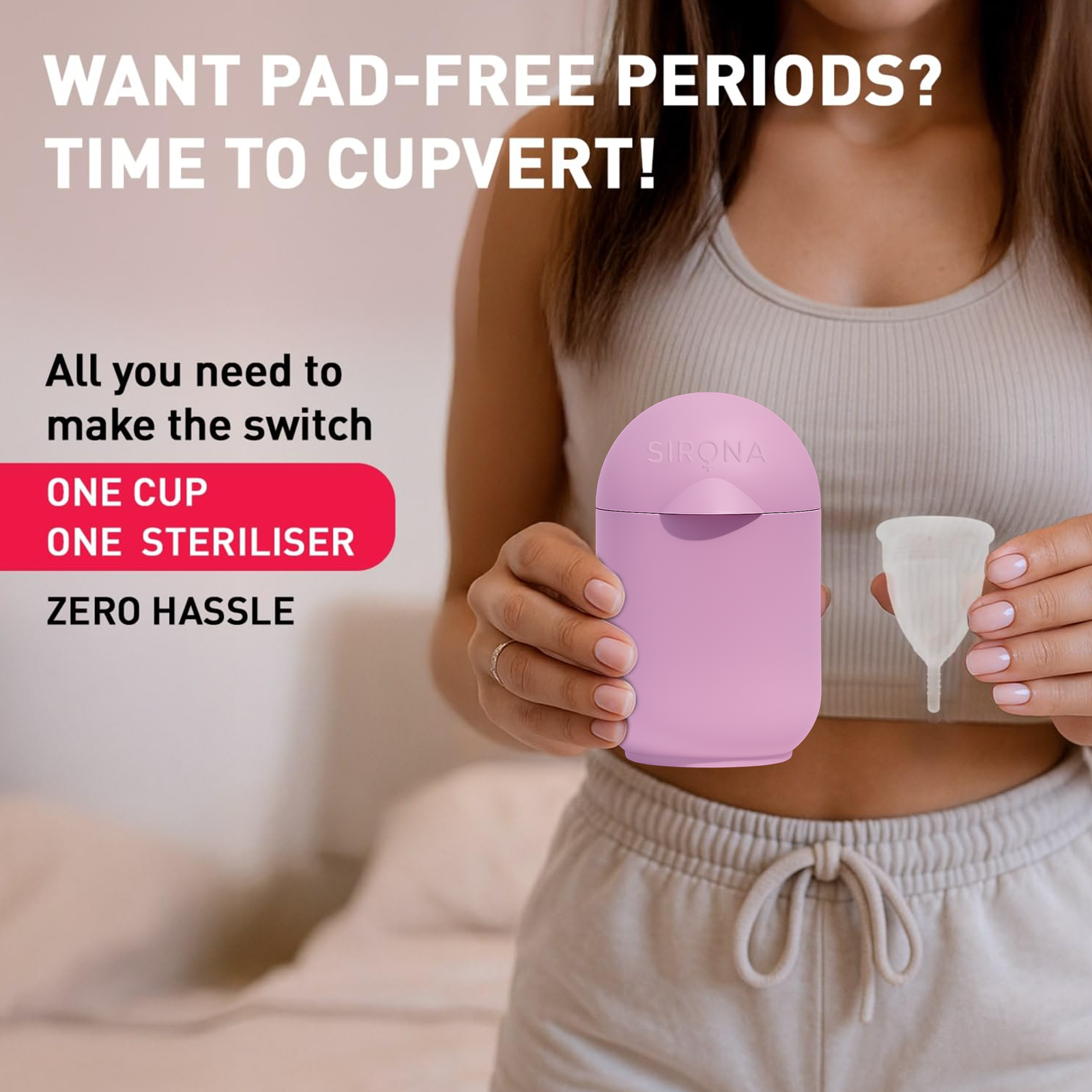 Person holding a pink menstrual cup and sterilizer