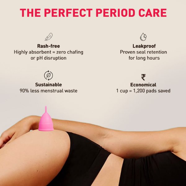 Person holding a menstrual cup with &