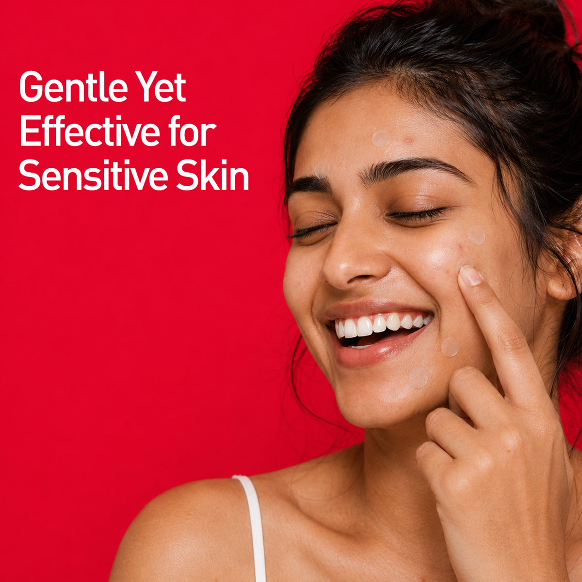 Smiling woman with dark hair wearing transparent acne pimple patches on face against red background with text