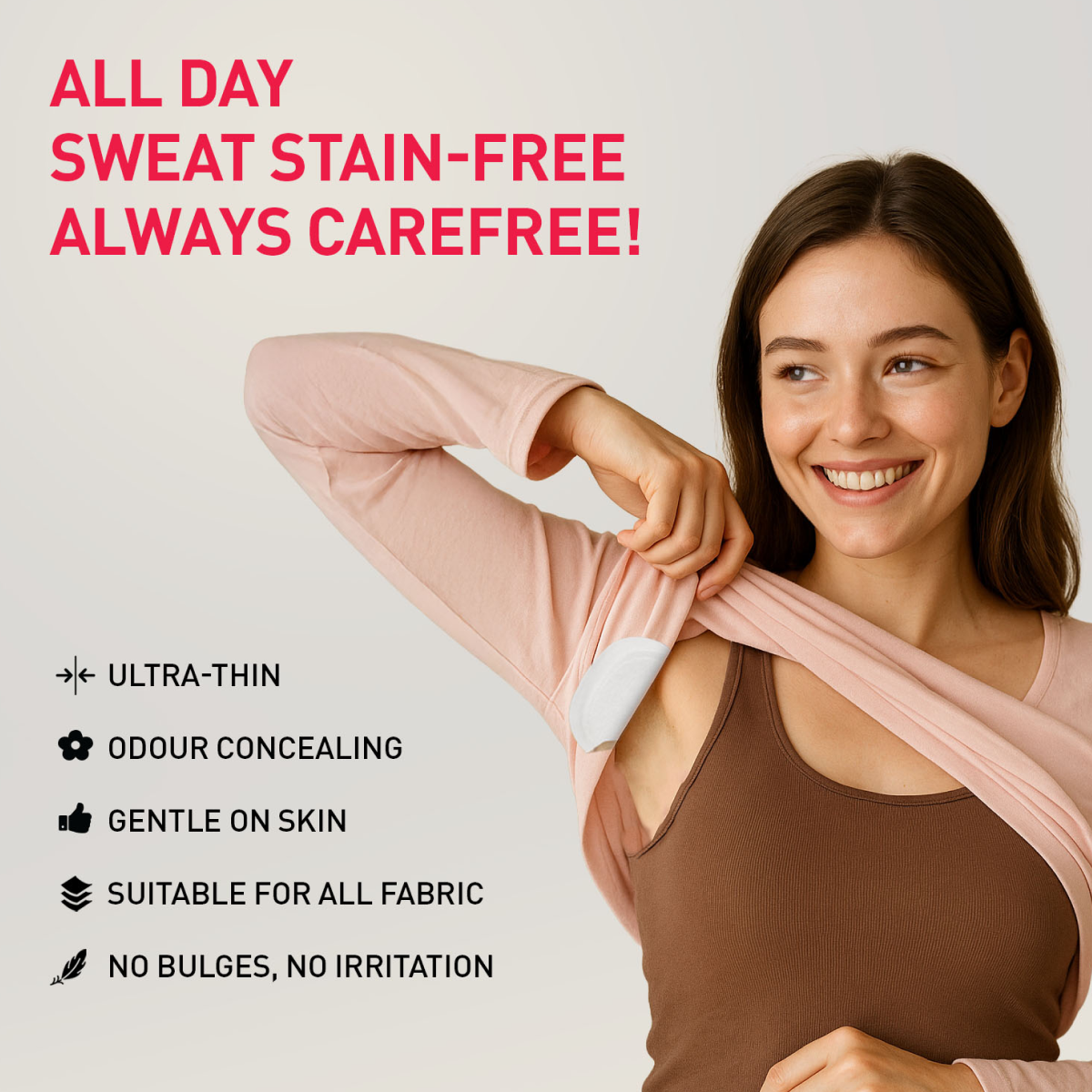 Woman wearing a pink sweatshirt with underarm sweat pad