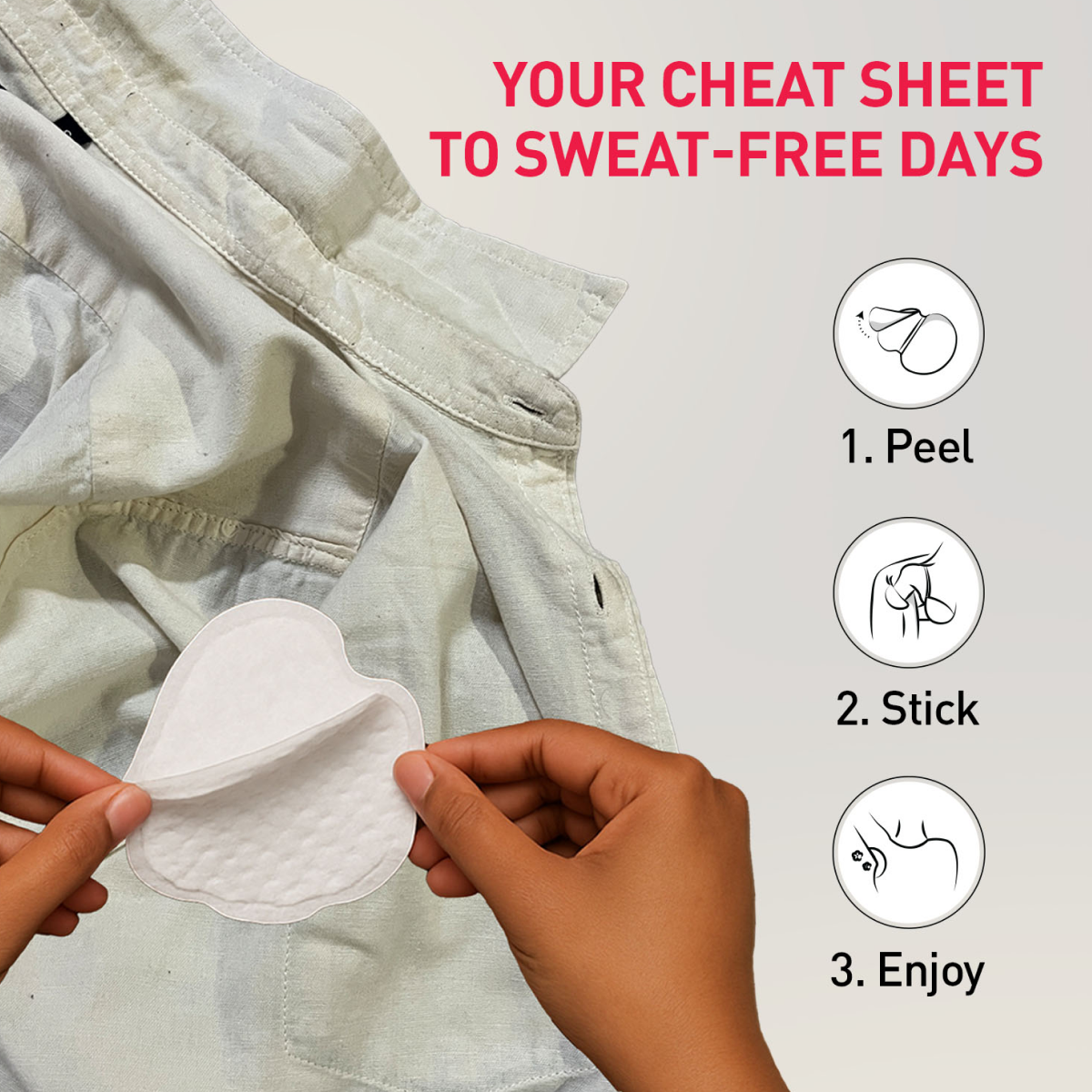 Hands applying a sweat pad to a shirt 