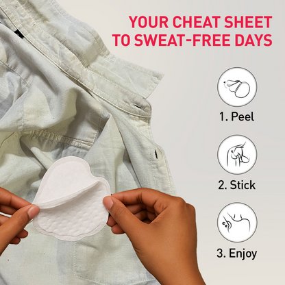 Hands applying a sweat pad to a shirt 